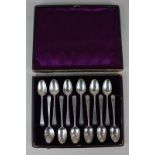 A set of eleven, and one similar, early 19th century silver teaspoons with Old English pattern