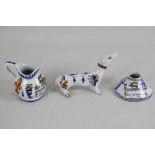 Three pieces of faience pottery, each inscribed 'Chambord', comprising an inkwell and milk jug, both