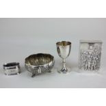 A German 800 silver napkin ring, a Chinese silver egg cup, an Indian white metal bowl, and a