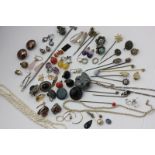 A collection of stick and hat pins, a seed pearl necklace, a 'rice' pearl necklace and a