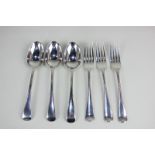 A set of three George V silver Hanoverian pattern dessert spoons, makers Josiah Williams & Co,
