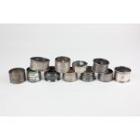 A collection of eleven Victorian and later silver napkin rings, to include one with the London Rifle