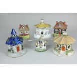 Five Staffordshire and similar pottery pastille burners, mostly cottages, two with detachable roofs,