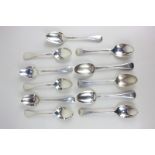 A mixed set of eleven Edward VII and George VI silver Old English pattern dessert spoons with