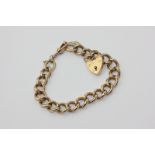 A 9ct gold solid curb link bracelet with padlock clasp, 49.1g
