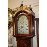 A George III flame mahogany longcase clock, maker James Smith Lynn, the domed 12 inch silverised