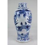 A Chinese porcelain blue and white baluster vase decorated with figures on a bridge amongst a