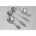 A George IV silver fiddle pattern caddy spoon with engraved initials, London 1826, a French silver