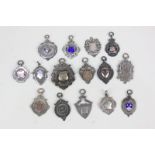 A collection of early 20th century silver and other metal sporting medals including thirteen with