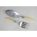 A Victorian silver fish serving set of fork and slice, with pierced decorative blade and engraved