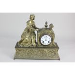 A French gilt metal mantel clock with a figure of a lady playing the piano, 8cm white enamel dial