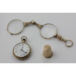A lady's 18ct gold open face pocket watch, a 9ct gold thimble, 5.3g, and a pair of gilt metal