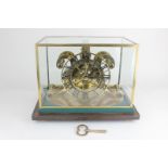 A brass Strutt type skeleton clock by Emperor Clock Company Ltd, the chapter ring with Roman