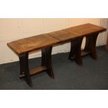 An oak monk's refectory type table with narrow rectangular plank top in three sections on trestle