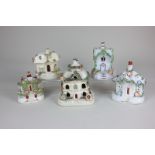 Five various Staffordshire pottery pastille burners modelled as cottages, largest 15cm