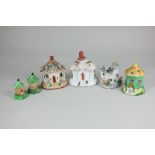 Six various Staffordshire pottery models of cottages, most pastille burners, largest 14.5cm, (a/f)