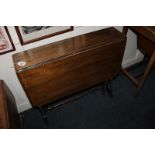 A mahogany Sutherland drop-leaf table with rectangular top and cut corners, on turned supports