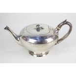 A Victorian silver teapot, plain circular form with rosebud finial and scroll handle, maker probably