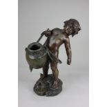 After Auguste Moreau, a bronzed metal figure of a boy carrying water, inscribed Auguste Moreau,