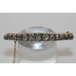 An old cut diamond thirteen stone bar brooch