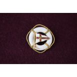 A Royal Yacht squadron brooch, gem set and within a white enamelled life belt, circa 1900 (a/f)