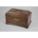 A George III mahogany tea caddy with cushion top and central brass handle, interior with later