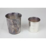 An early 20th century French silver beaker with engraved initials, 9cm, and another smaller, also