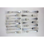 A mixed set of fifteen George III and George IV silver Old English pattern dessert forks with