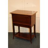 An Edwardian inlaid mahogany drinks table, the rectangular top with flap opening to bring up a