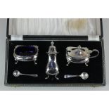 A modern cased silver three-piece cruet set of Georgian style, to include a pepper pot, mustard