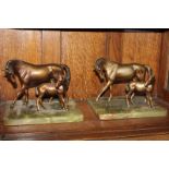 A pair of bronzed metal figure group models of a horse and foal, on green onyx bases, 21cm