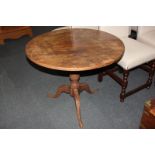 A 19th century oak tilt top circular pedestal table, 76cm diameter