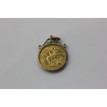 A 1908 half sovereign in a gold pendant mount