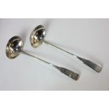 A pair of Scottish provincial silver sauce ladles with engraved fiddle pattern handles and oval