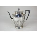 A German 800 silver coffee pot of half reeded form with cone finial, makers Koch & Bergfield,