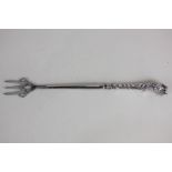 An Elizabeth II silver handled pickle fork with lion head finial, marks worn, Birmingham 1972