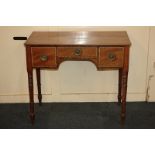 An Edwardian mahogany inlaid rectangular kneehole desk with an arrangement of three drawers, with