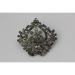 A 19th century paste brooch, pearl set in silver on gold