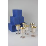 A set of six modern silver wine goblets with gilt interiors, flared bowls on pedestal bases with