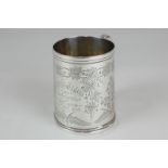 A Victorian Exeter silver christening mug engraved with ivy, ferns and shepherd's purse, with
