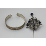 A French silver, marcasite and lapis brooch, and an Egyptian silver bangle