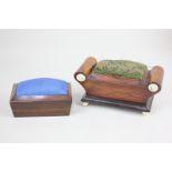 Two 19th century rosewood pin cushions, comprising a needle box formed as a stool, with pin