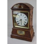 A 19th century cuckoo mantel clock with 14cm white enamel dial, and Roman numerals, in domed case