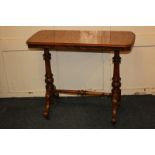 A Victorian walnut inlaid side table, rectangular form with quarter veneered top, end supports