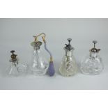 Four American white metal mounted cut glass scent bottles, all marked sterling