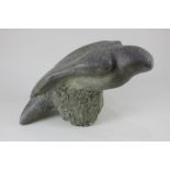 A carved stone sculpture of a bird of prey, 24cm, (a/f)