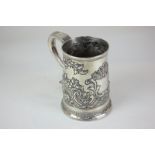 A George III silver tankard, maker John Langlands, Newcastle 1778, with embossed floral design and