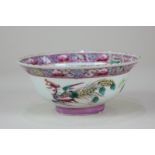 A Chinese porcelain famille rose bowl decorated with flowers and a ho ho bird, character marks to