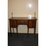 An Edwardian inlaid mahogany sideboard with metal framed gallery (missing curtain) and cross