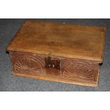 A rectangular oak bible box with foliate carved front, 61cm